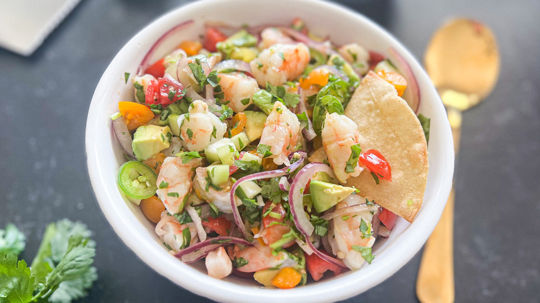 tortilla chip in bowl of ceviche