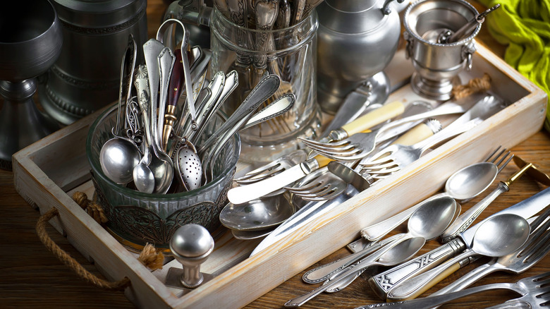 Silverware on a table at a thrift store