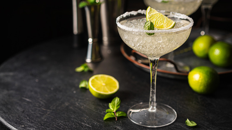 classic margarita cocktail with lime and mint as garnish