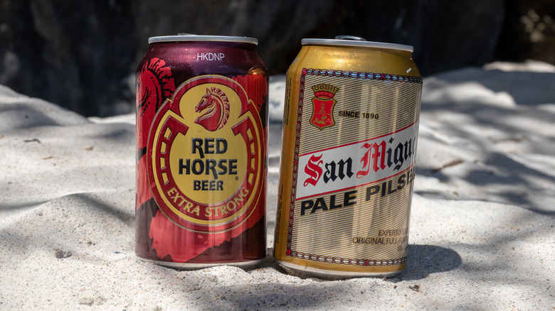 San Miguel cans on beach