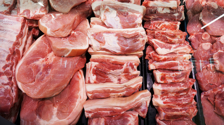 Selection of beef, piece of pork, and cutlets.