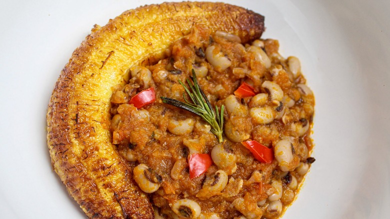 red red with a fried plantain in white bowl