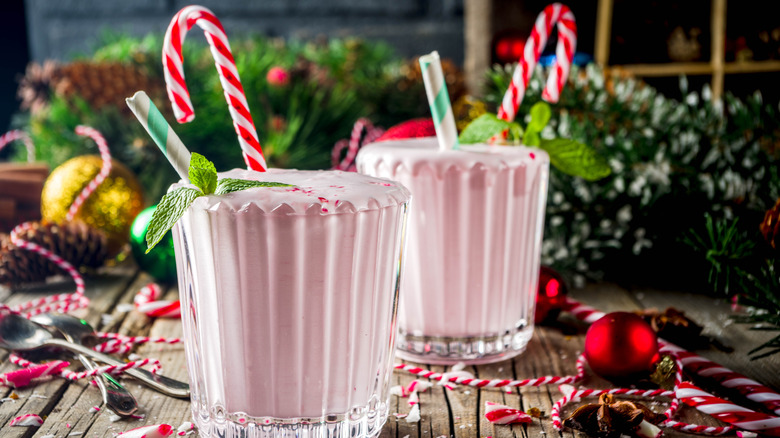 two peppermint milkshakes on a red background