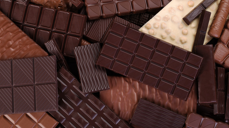 An assortment of large chocolate bars in a pile