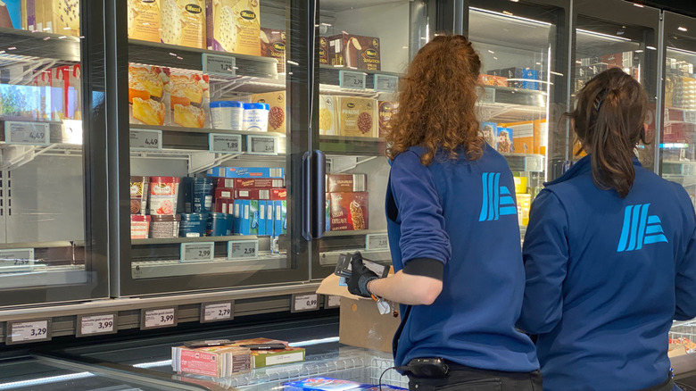 Aldi workers in the frozen aisle