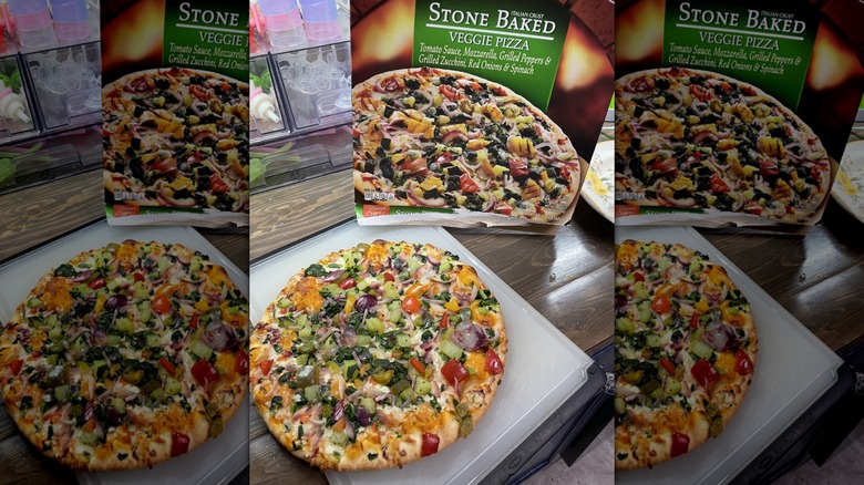 Aldi's Italian Crust Stone Baked cooked frozen pizza next to its box