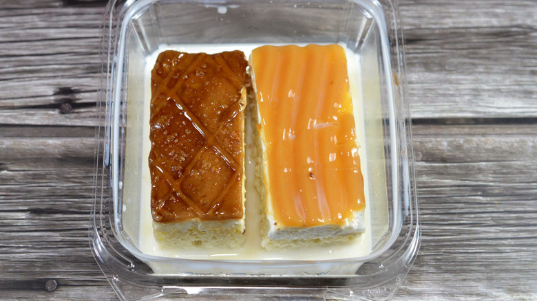 two types of tres leches in a plastic container