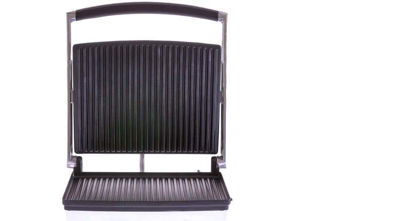 Open panini press on white background 