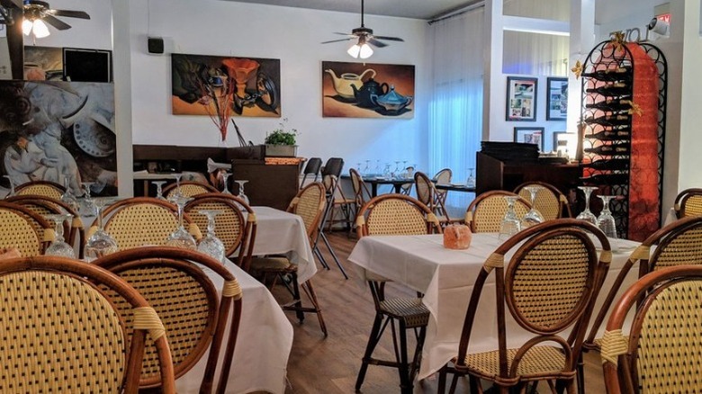 Inside Le Bistro with tables set and ready for service