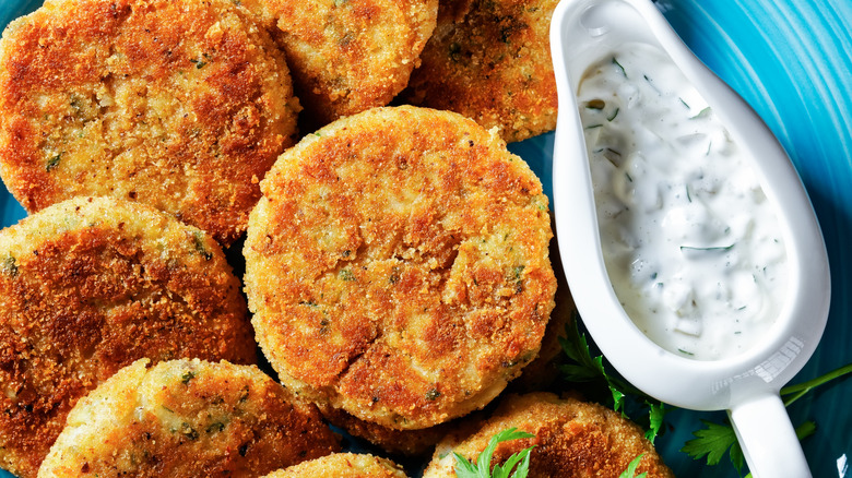 fish cakes and tartar sauce on plate