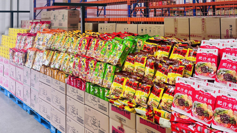 Packages of food on display in a Resco warehouse aisle