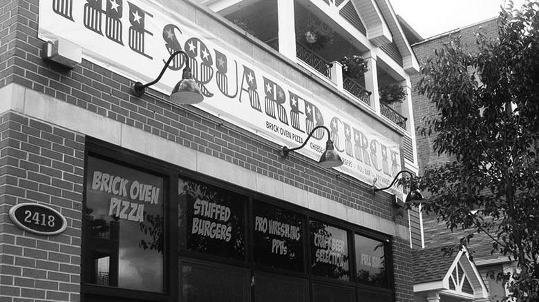 A black and white photo of The Squared Circle, a restaurant and sports bar in Chicago, Illinois
