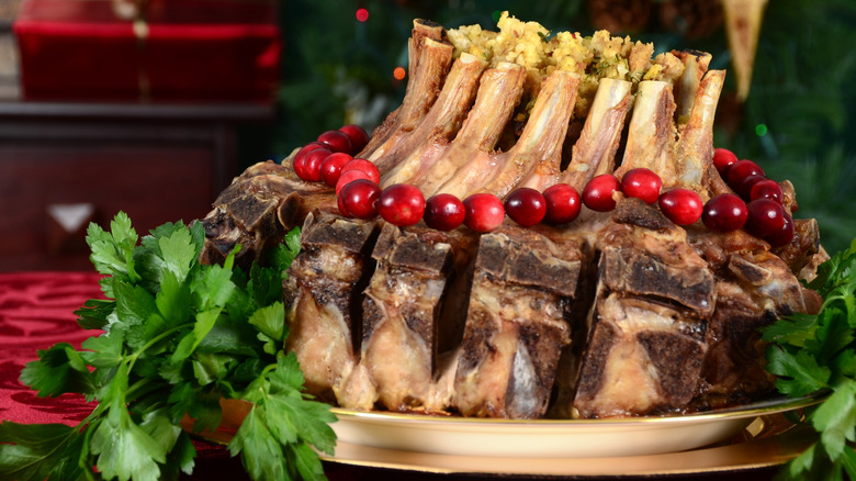 Pork crown roast with stuffing on a plate placed on a table