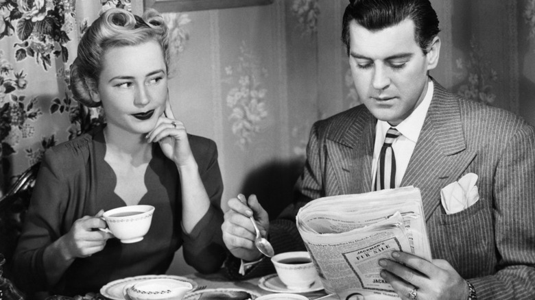Vintage photo of couple drinking coffee at a breakfast table