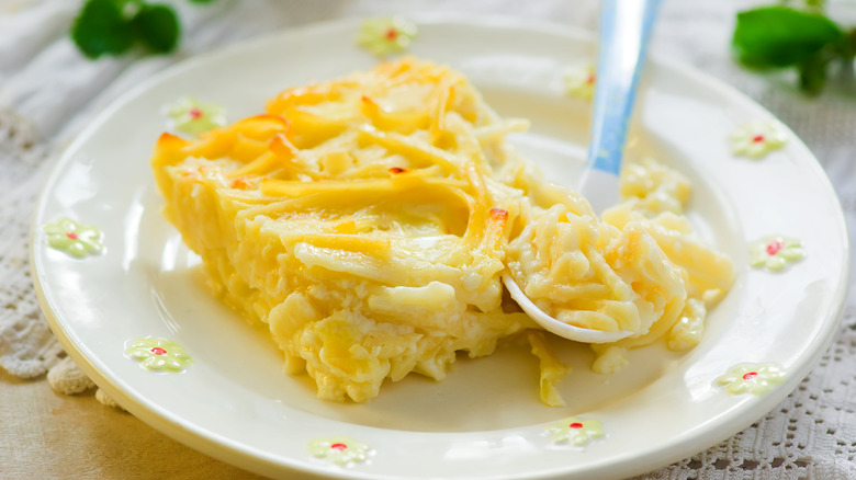 Piece of macaroni pudding on a white plate