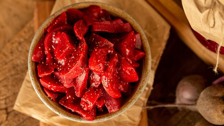 Harvard beets in bowl on wooden table
