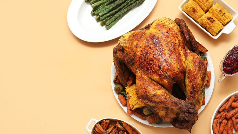 An overhead view of a Thanksgiving turkey, surrounded by sides