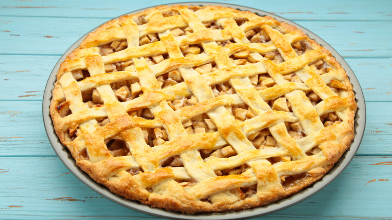 An apple pie topped with a pastry lattice