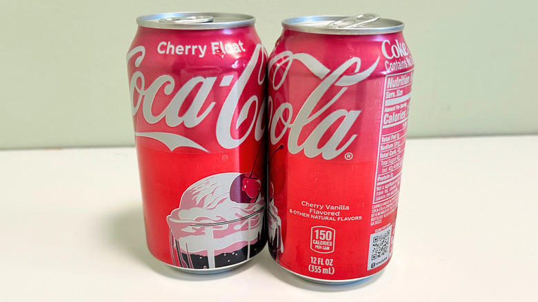 Two cans of Coca-Cola Cherry Float lined up to spell out the Coca-Cola label
