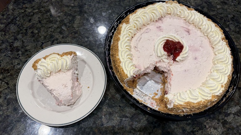Strawberry Cream Pie slice on plate next to full pie