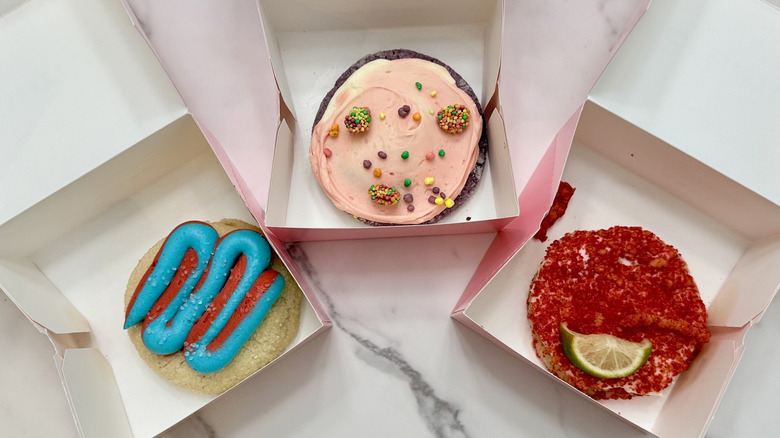 Three cookies in boxes