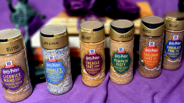 Six jars of Harry Potter finishing sugar flavors in a line