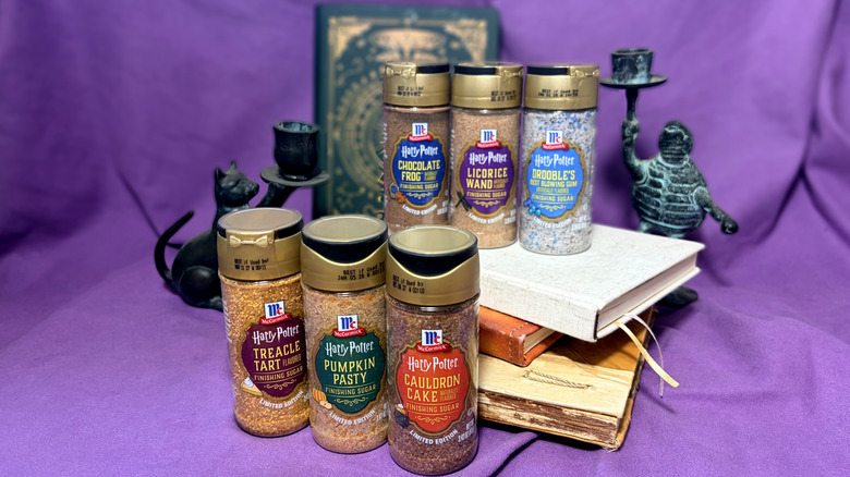 Six jars of Harry Potter finishing sugar flavors in front of purple background