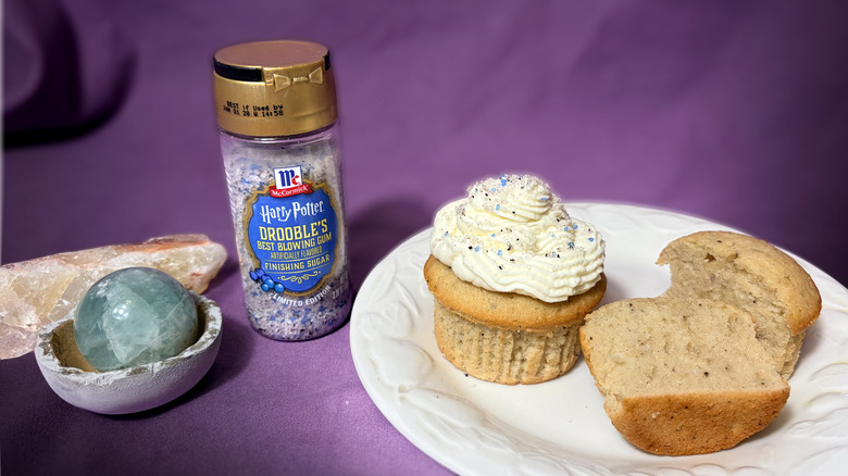 Jar of flavored sugar next to plate with cupcakes