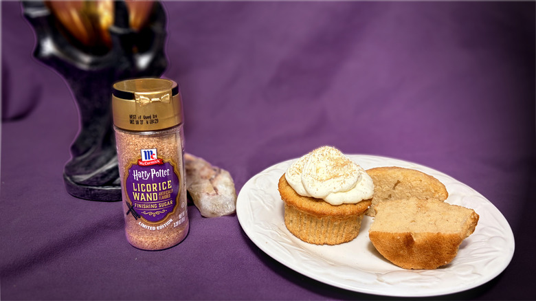 Jar of flavored sugar next to plate with cupcakes