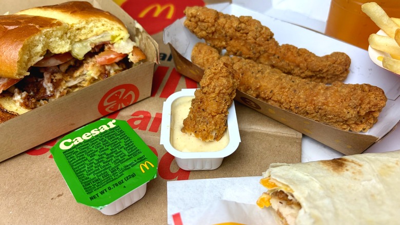 The new McDonald's Caesar sauce and chicken menu showing strips, a wrap, and a burger