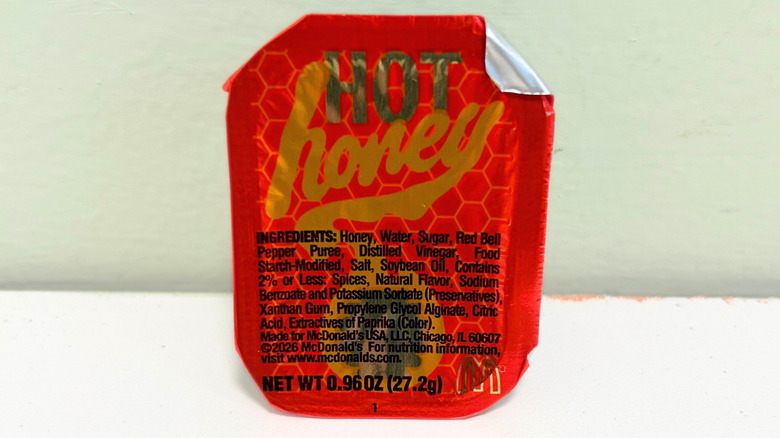 Close up of an unopened Hot Honey Sauce packet from McDonald's