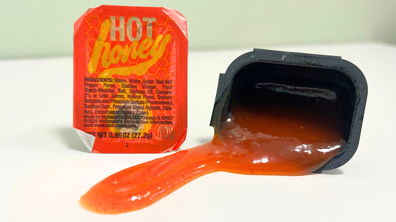 McDonald's Hot Honey lunch menu items arranged together with two Hot Honey Sauce packets