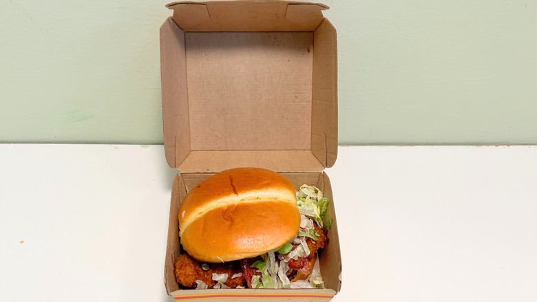 McDonald's Bacon Hot Honey McCrispy Sandwich inside it's to-go box