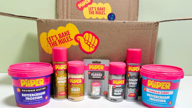 Several PiiPER baking products arranged in front of a decorated shipping box