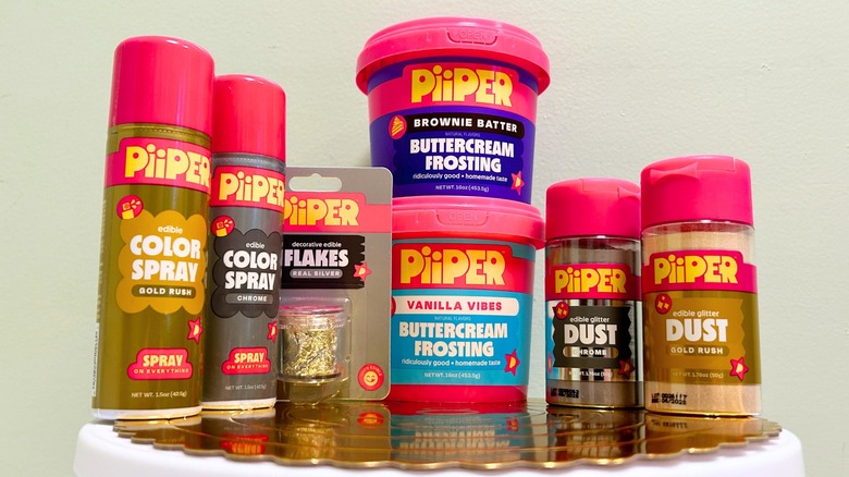 Several PiiPer products arranged on a metallic cake board