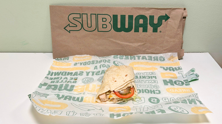 A Peppercorn Ranch Chicken Protein Pocket on a wrapper in front of a Subway bag