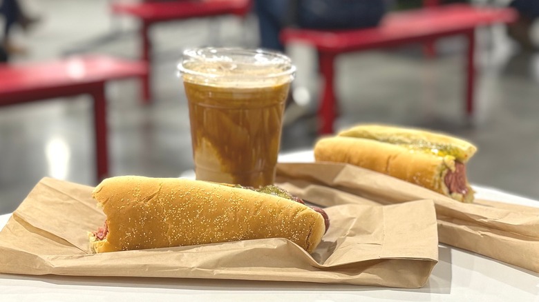 Caramel Cold Brew Freeze on a table, next to Costco hot dogs
