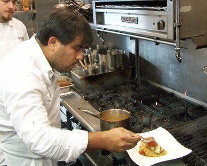 Ricardo Zarate cooking Paiche