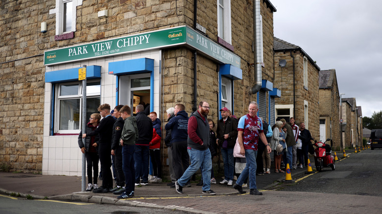 Lines at a fish and chip shop in the UK