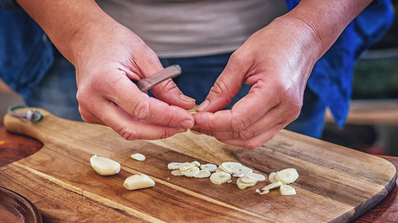 Person chopping garlic 