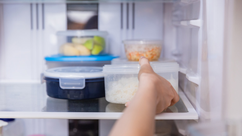 A refrigerator shelf of plastic food storage 