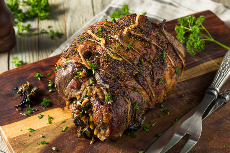 Roast Leg of Lamb Stuffed With Sun-Dried Tomatoes, Basil Pesto and Goat Cheese recipe - The Daily Meal