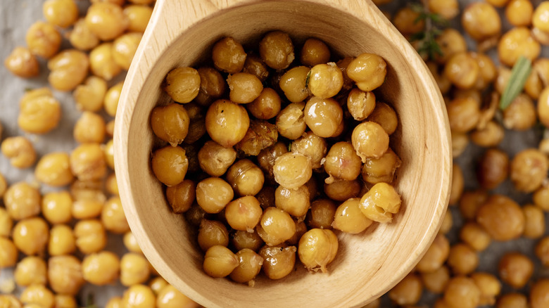 Seasoned roasted chickpeas in a wooden spoon