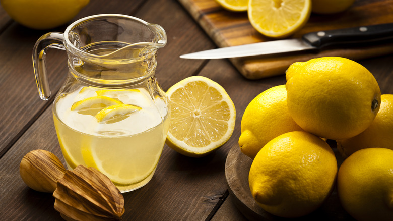 Jug of lemonade and lemons