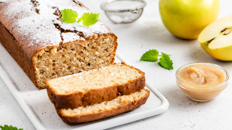 sliced applesauce bread with apple in background