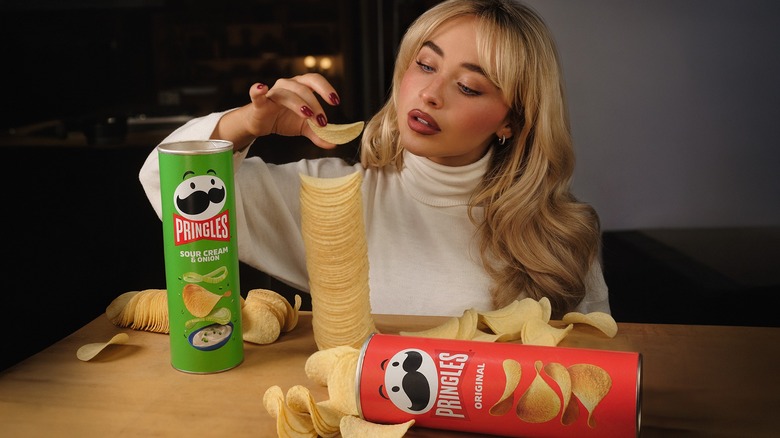 Sabrina Carpenter stacking Pringles.
