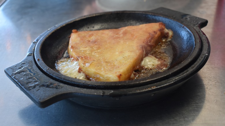 cheese saganaki in cast iron pan