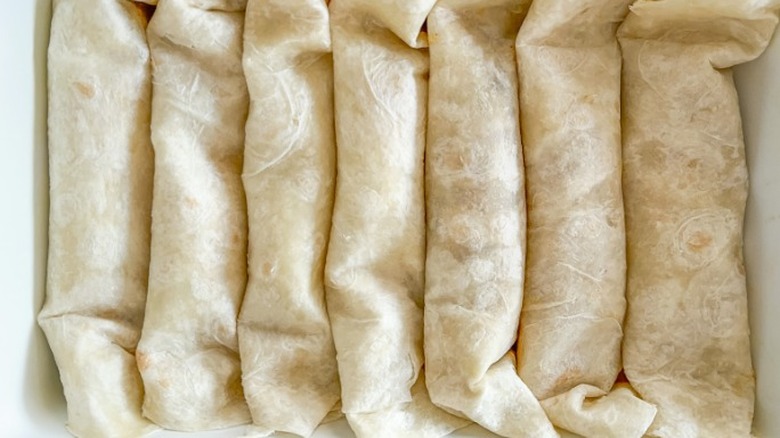 enchiladas rolled up in baking dish