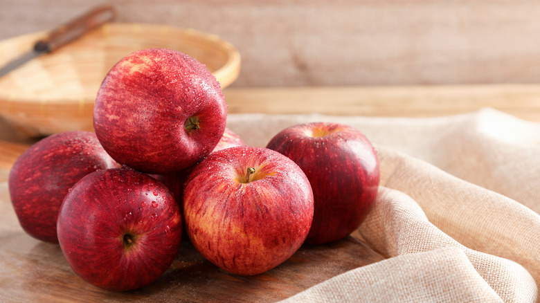 Red apples on cloth