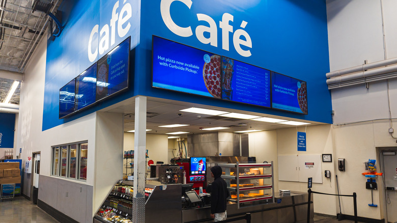Sam's club food court with someone checking out at the register
